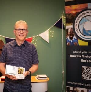 Alan receives his prize