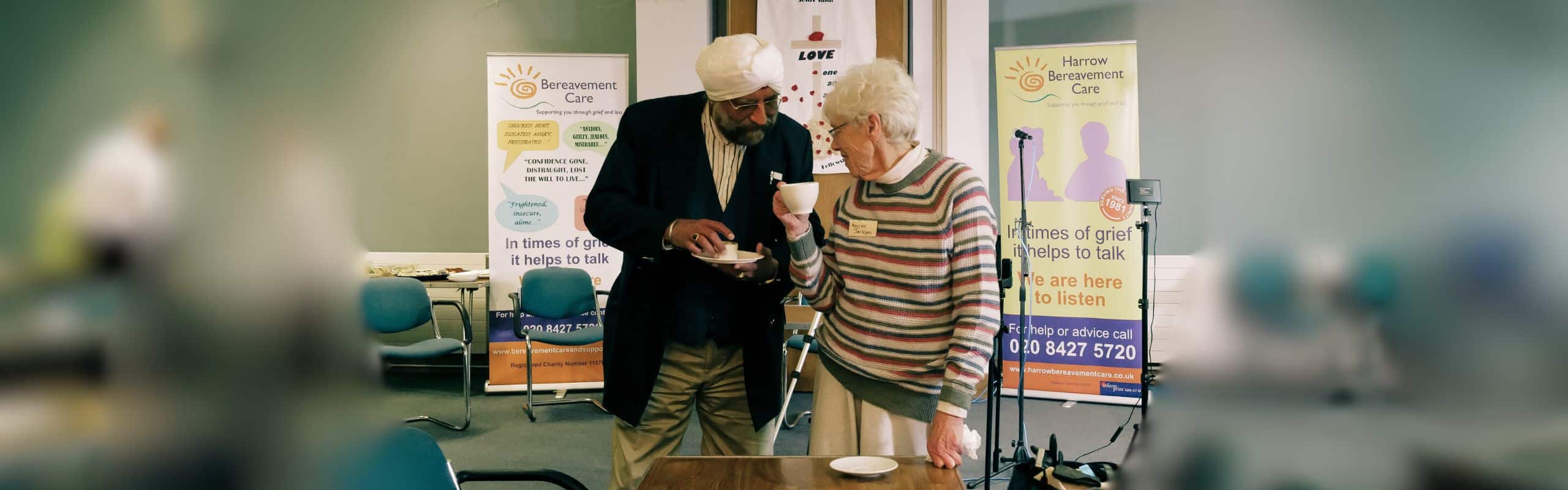 Two people chat at a Bereavement Care event