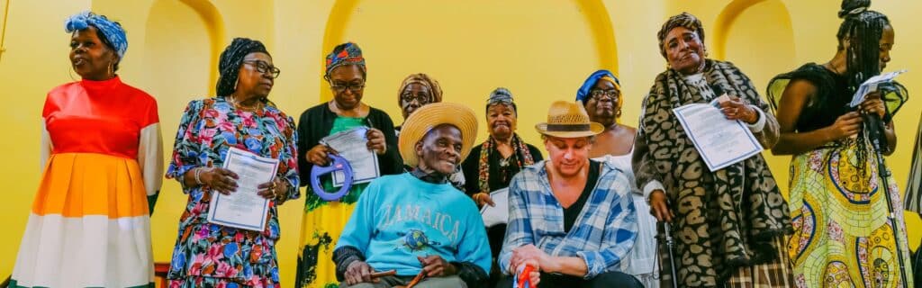 A group perform songs from the Windrush generation at a HACAS event