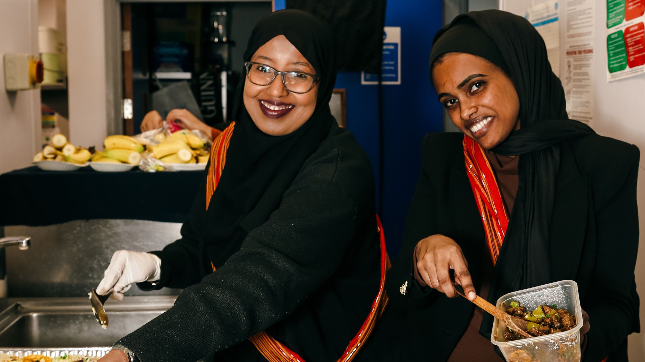 Women serving Somali food at a HASVO event