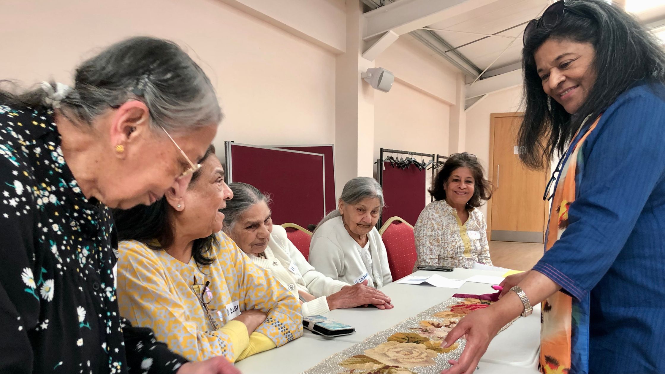 Sharing stories at an Oshwal event